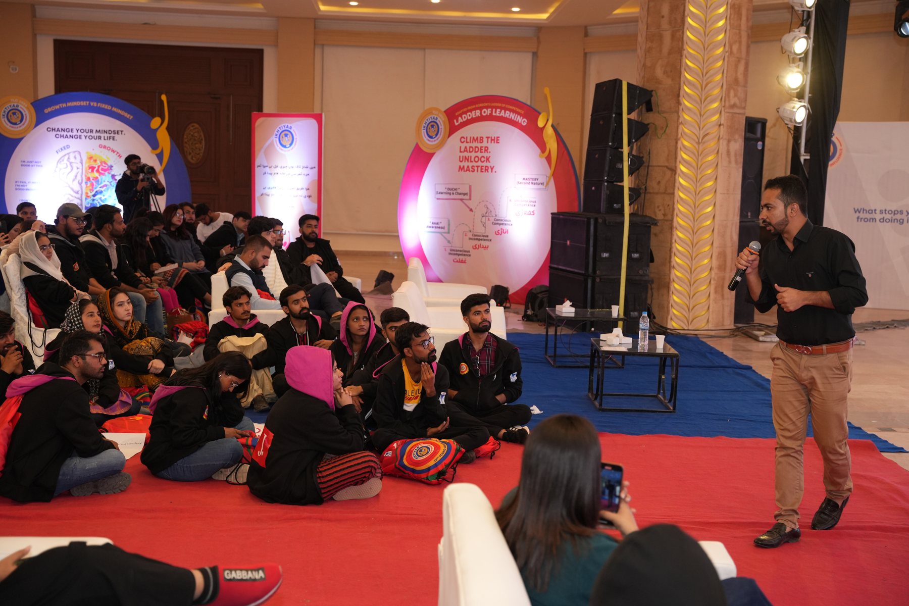 Zaamran Baloch facilitating a large learning event